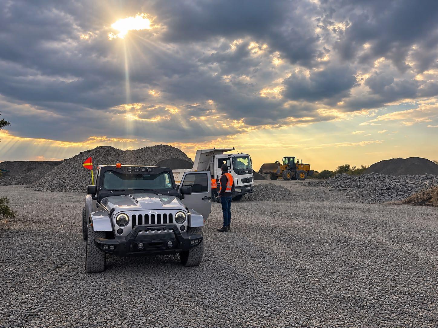 Stockyard at sunset with a loaded truck